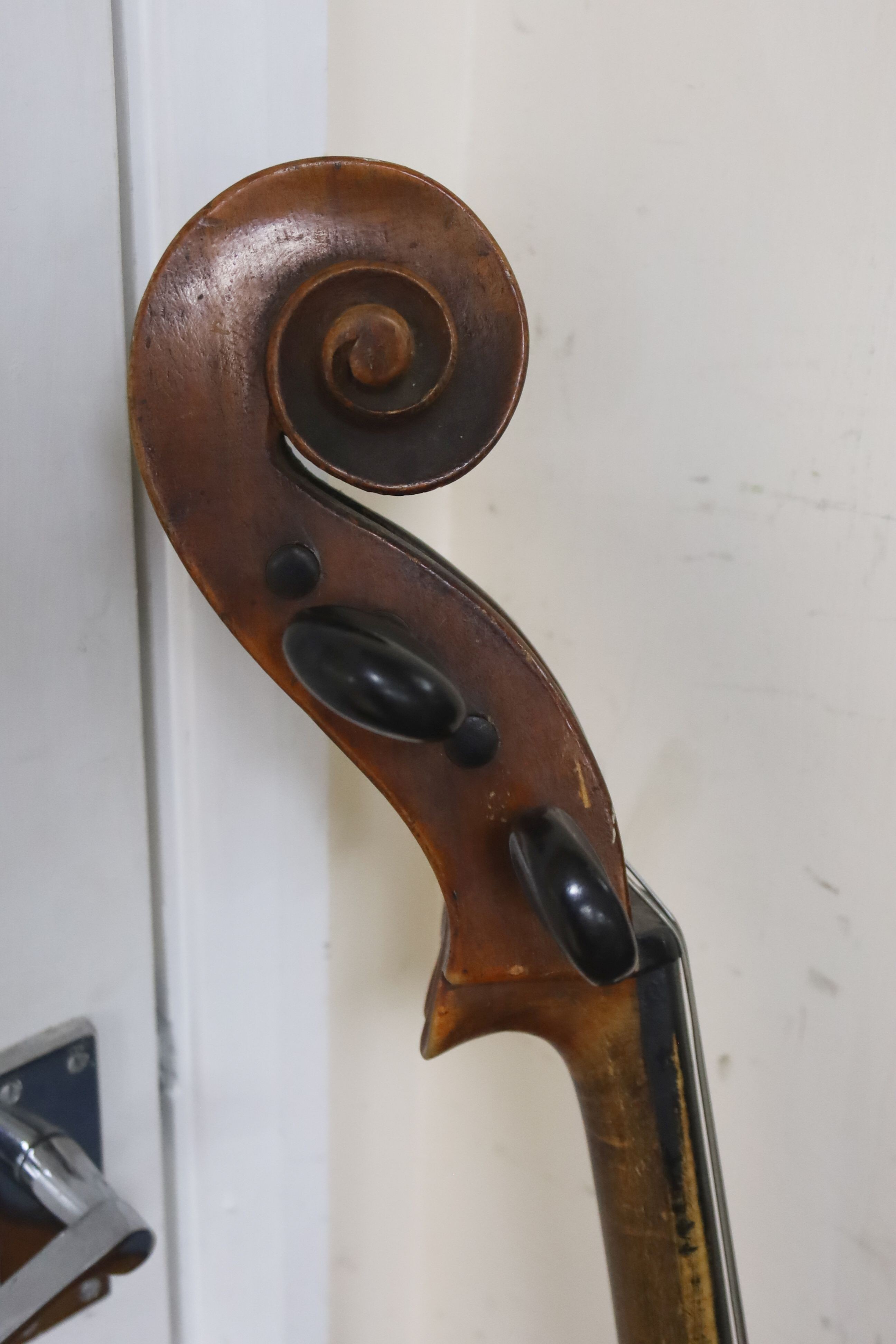 Early 20th century German cello and bow, the back measuring 75cm excluding the button